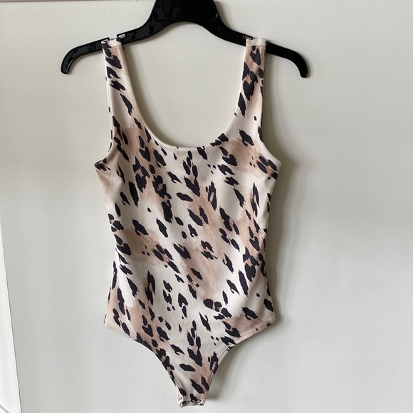 Express Tops - “Express” body contour, animal print bodysuit; worn once for pictures; size XS